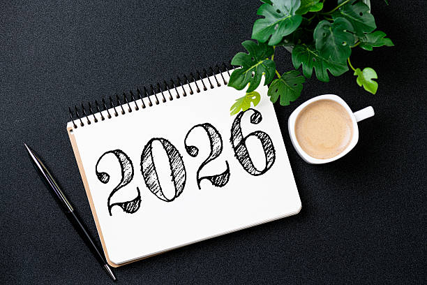 istock New year resolutions 2026 on desk. 2026 resolutions list with notebook, coffee cup on pink background. Goals, resolutions, plan, action, checklist concept. New Year 2026 template 2230148349