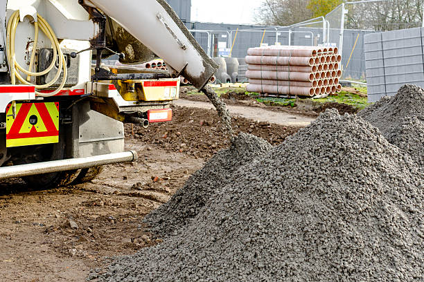 istock Semy-dry ready mix concrete delivered on construction site and unloaded into pile on ground 2230148430