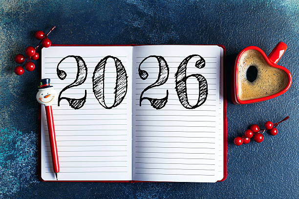istock New year resolutions 2026 on desk. 2026 goals list with notebook, coffee cup on blue table. Resolutions, plan, goals, action, checklist, idea concept. New Year 2026 resolutions 2230148755