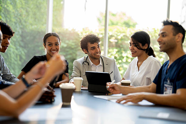 istock Group of Medical Professionals Collaborating in a Bright Office Setting 2230151914