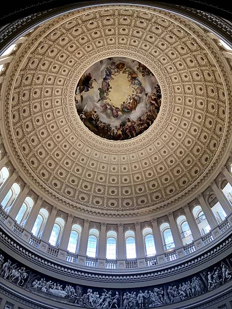 Views  from various angles of the United States Capitol building in Washington DC.  The Capitol building is where both the Senate and the House of Representatives meet in Washington, DC.  Bedsides its political function, the Capitol is also a museum of American art and history.    The building was first used around November of 1800.  The style of the building is considered Neoclassical and measures in excess of 1.5 million square feet on five levels.  It is the working heart of the legislative branch of the US.