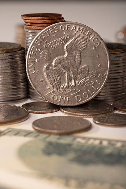 istock A stack of dollar coins stacked on each other in different positions. Money 2230152383
