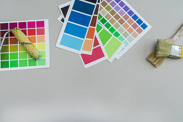 istock brushes on a palette color guide, renovation concept.  Color catalog for tinting facade a 2230154544