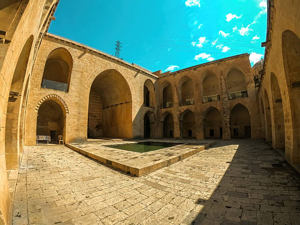 istock Kasimiyye Madrasa in Mardin, Turkey, featuring historic architecture, ancient stonework, and cultural heritage. 2230155755