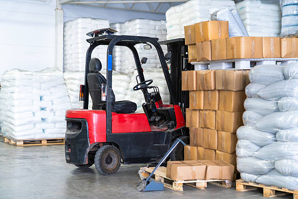 istock Forklift warehouse in logistics packaging pallets boxes storage distribution shipping. Supply chain fulfillment, delivery cargo operations 2230156835