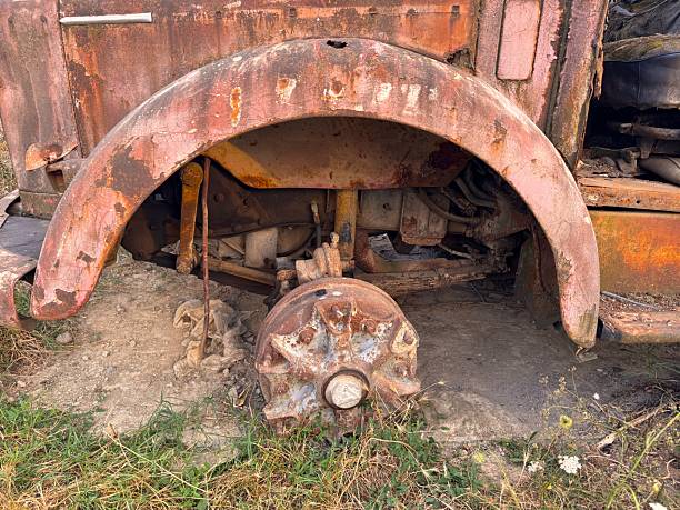 istock An old and decayed car in a cloudy evening as the sun sets 2230157376