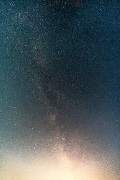 Bright Milky Way stretching across a clear night sky with countless stars visible.