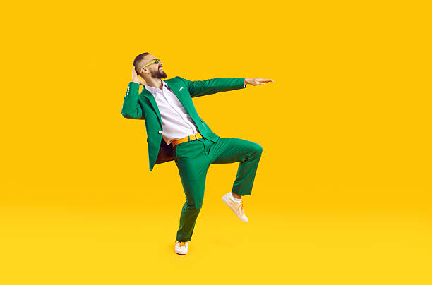 istock Cool and stylish young man is having fun dancing celebrating Saint Patricks Day. 2230159071