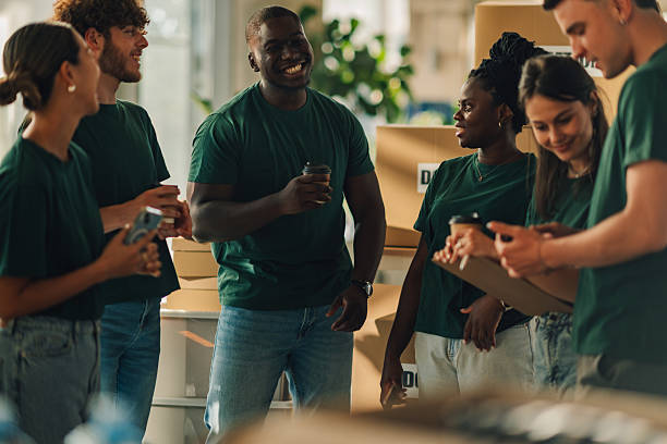 istock Volunteers chatting and drinking coffee during break 2230159333