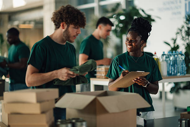 istock Volunteers preparing donation boxes at charitable organization 2230159442
