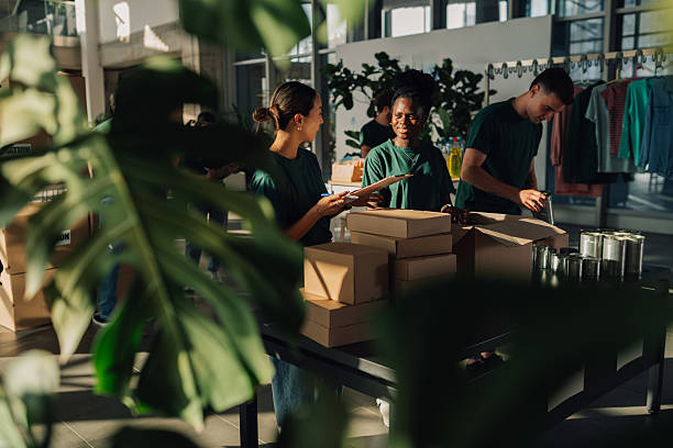 istock Volunteers preparing donation boxes at charity organization 2230159478