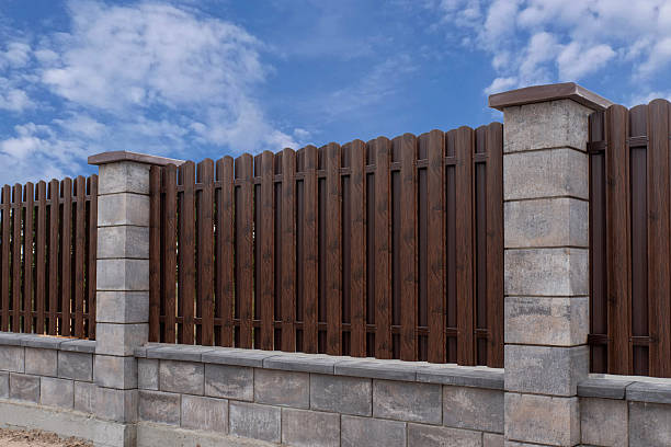 istock Metal picket fence with stone columns 2230160650