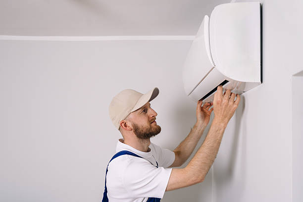 istock Maintenance technician performs air conditioning installation in a modern apartment 2230160934