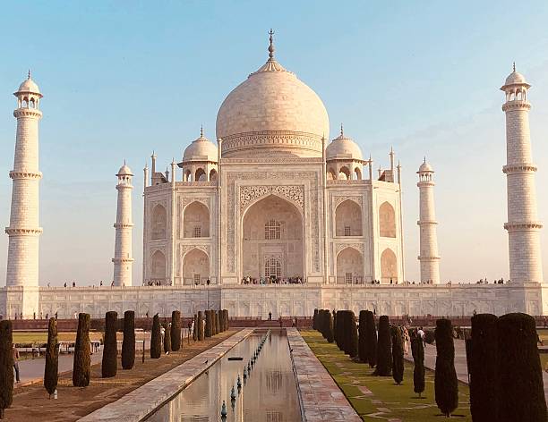 February 16, 2013 - Agra, India.  Visitors to the Taj Mahal exploring the famous landmark during an early morning rain storm.