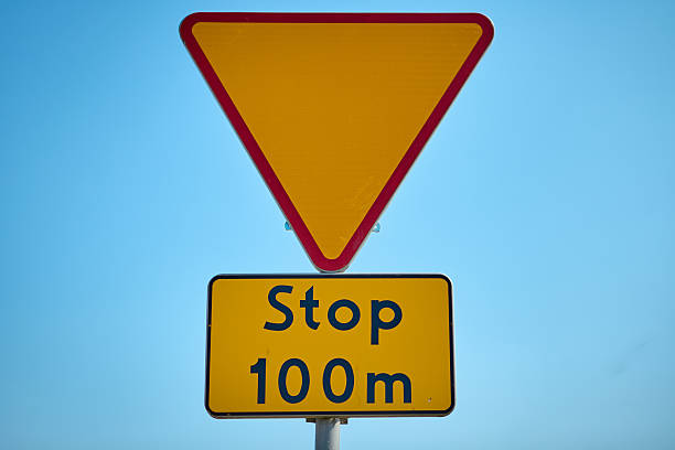 istock Yield traffic sign symbol on a sunny rural roadside 2230164530