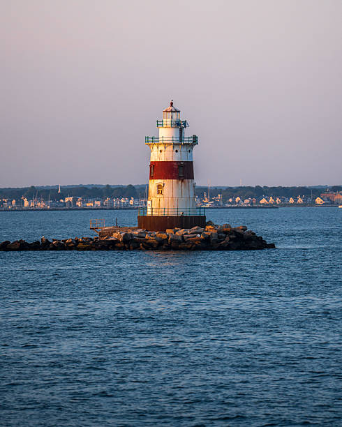 istock Old Navigation Lighthouse in the middle of the sea 2230167643
