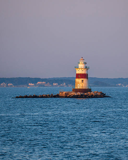 istock Old Navigation Lighthouse in the middle of the sea 2230167651
