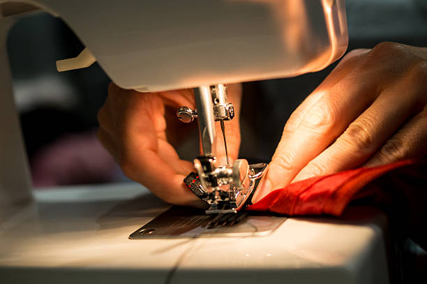istock Seamstress sewing haute couture clothing 2230170121