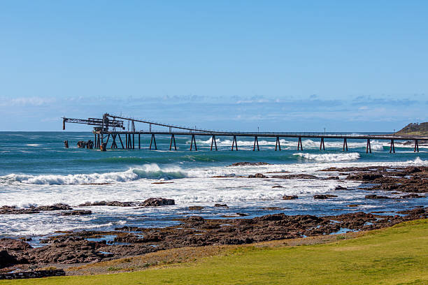 istock An old and weathered industrial loading jetty and crashing waves 2230170626