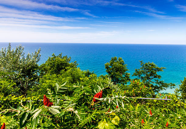 Aerial shot of Lake Michigan at sunset from near Little Sable Point Light in Silver Lake State Park in Golden Township, Oceana County.