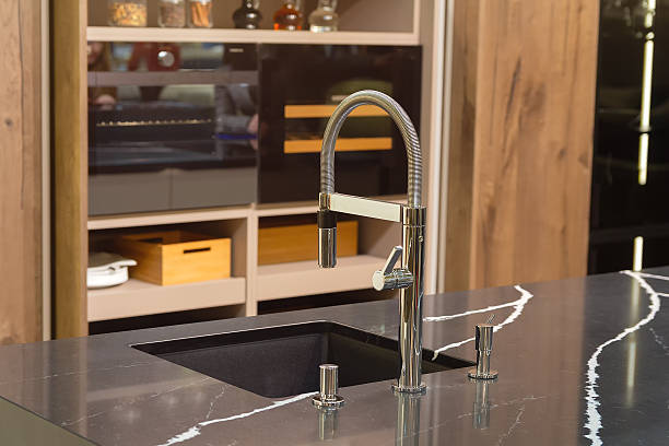 istock Faucet and sink in a modern, elegant kitchen 2230175533
