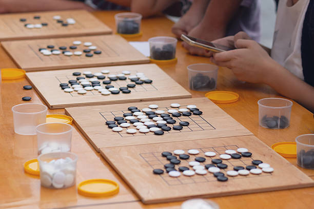 istock People participate in the go game 2230175623