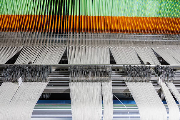 istock Modern weaving machine with wool warp and heddles in textile manufacturing closeup 2230176227