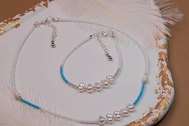 istock Beautiful handmade necklace and braclet on background 2230178494
