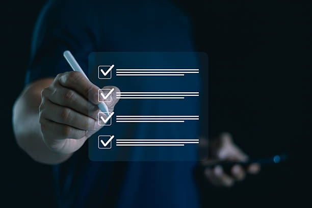 istock Businessman using digital pen to mark checklist on virtual screen, concept of task management, productivity, project planning and digital workflow for business success and efficiency. Online exam. 2230178867