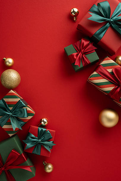 istock Holiday themed vertical composition featuring wrapped presents and ornaments, evoking a warm and festive atmosphere 2230179530