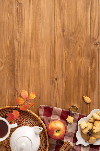 istock Warm vertical flatlay autumn themed setup featuring tea, cookies, apples, and a cozy setting. Ideal for seasonal concepts 2230179558