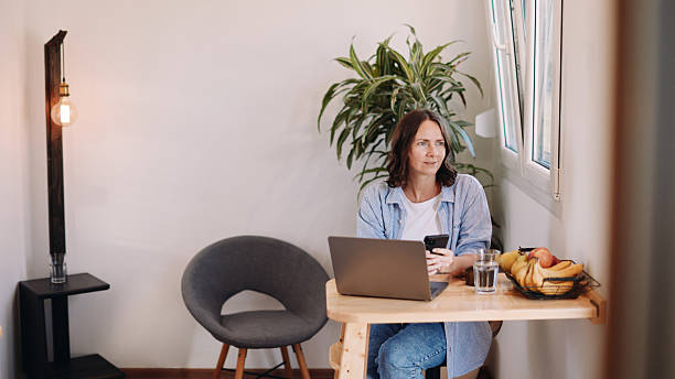 istock Woman Working from Home in a Tiny House – Minimal, Focused Workspace 2230183374