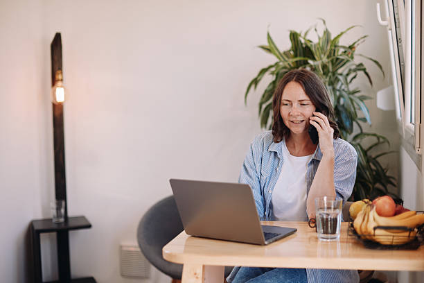 istock Woman Working from Home in a Tiny House – Minimal, Focused Workspace 2230184051
