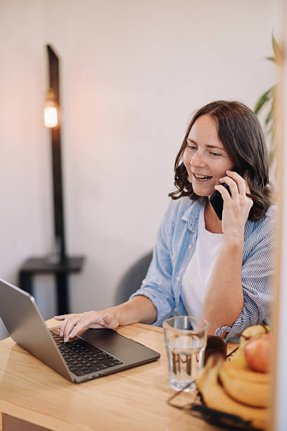 istock Woman Working from Home in a Tiny House – Minimal, Focused Workspace 2230186569