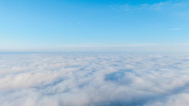 istock A vast expanse of white clouds under a clear blue sky 2230187329