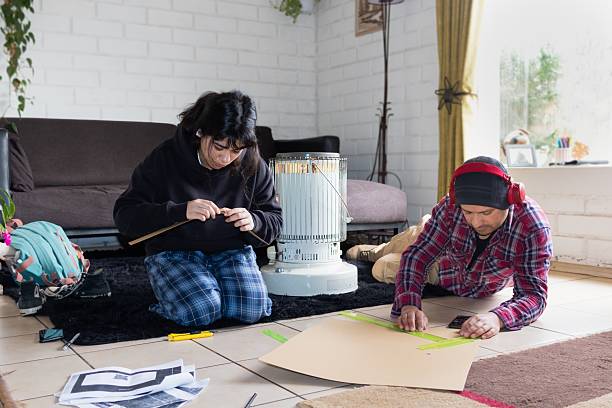 istock Dad helps his daughter prepare her school project. 2230199862