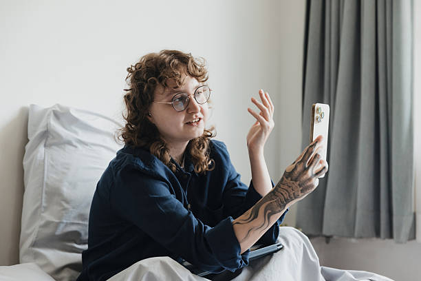 istock Engaging conversation on a smartphone from bed in a cozy room during a relaxed morning 2230204252
