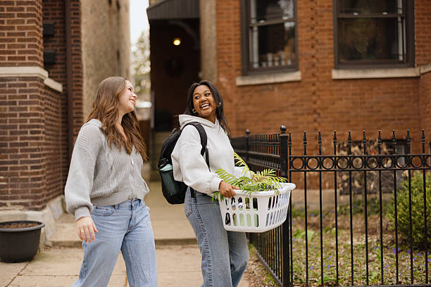 istock Two young female students walking and talking on campus 2230204884
