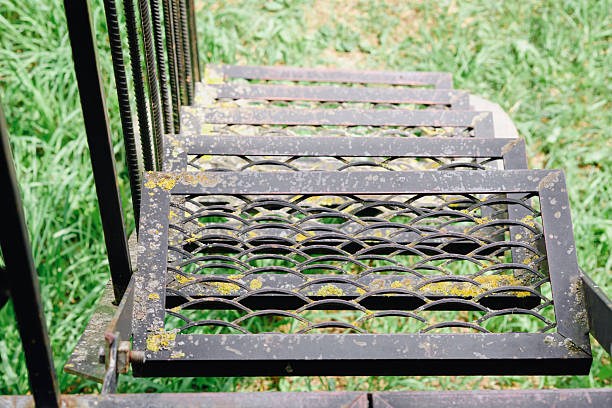 Detail of a stone staircase whit iron banister - toned image