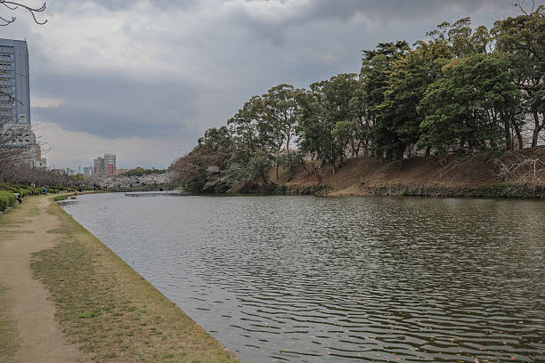 istock March 27 2025 Serene Pathway Along a Waterfront Under Cloudy Skies, Japan 2230206529