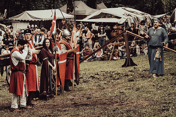 Craiova, Dolj County, Romania – May 14, 2022:  Fighters in authentic historical clothing at the medieval festival Michael le Brave ( Mihai Viteazul ). Reconstruction of a medieval battle.