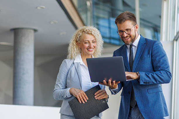 istock Businesspeople working together on laptop in office building 2230212863