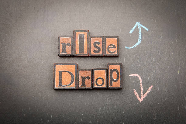 istock Rise and drop concept with wooden blocks and arrows 2230213143