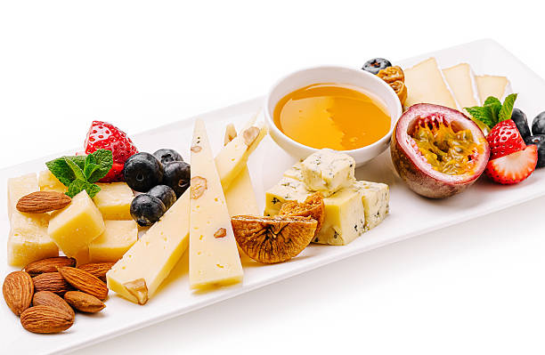 Cheese and fruit platter with honey and nuts for a delightful snack