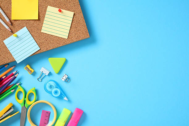 istock School flat lay with sticky notes, pencils, scissors, tape, and highlighters on blue background. Back to school concept. 2230224241