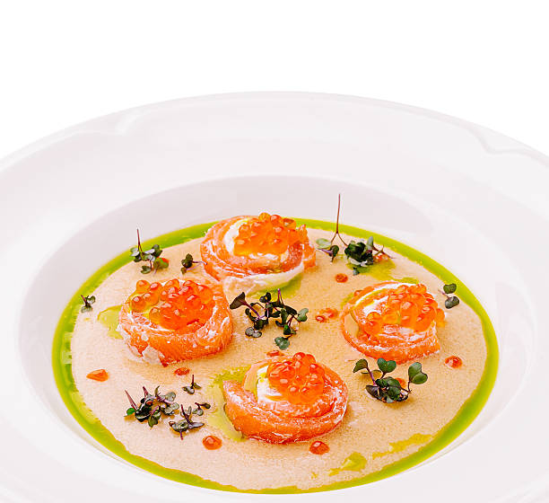 istock Delicate salmon rolls served in a gourmet dish with vibrant sauce 2230230645