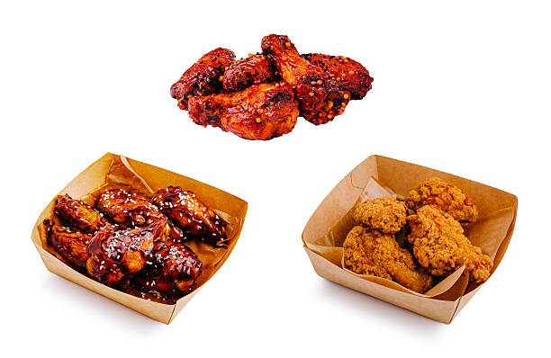 istock Different styles of fried chicken wings arranged in takeout containers 2230230722