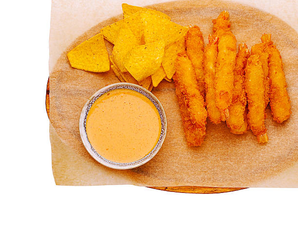 istock Crispy shrimp with tortilla chips and spicy dipping sauce served on a plate 2230230886