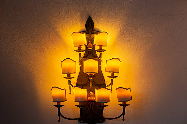 Antique candle shaped lights hanging.