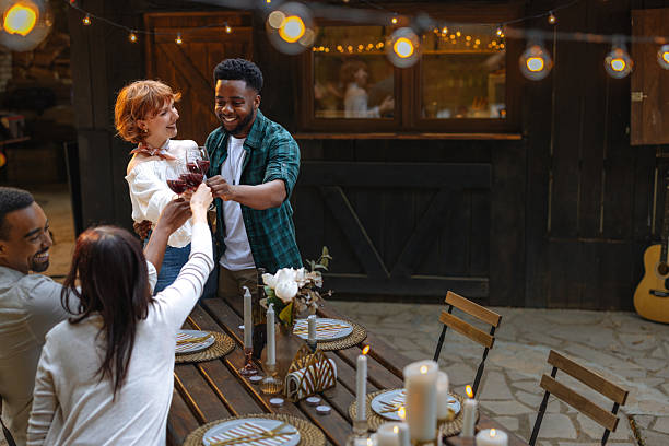 istock Friends toasting at an outdoor dinner party 2230231950